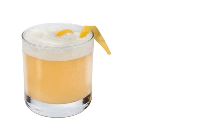 A glass of Apricot Whiskey Sour