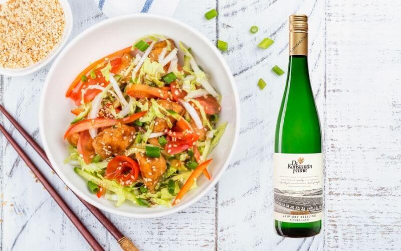 Asian salad with a dry Riesling bottle