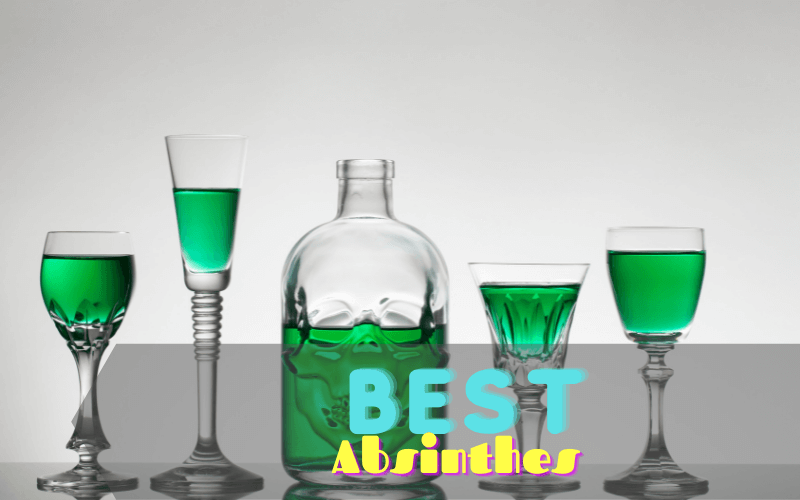 Shot glasses with absinthe with the absinthe bottle