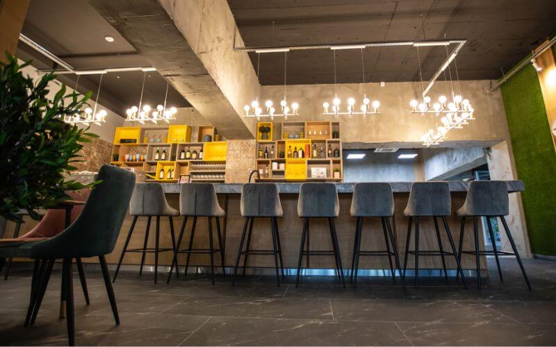 Bar stools in an industrial-style bar counter