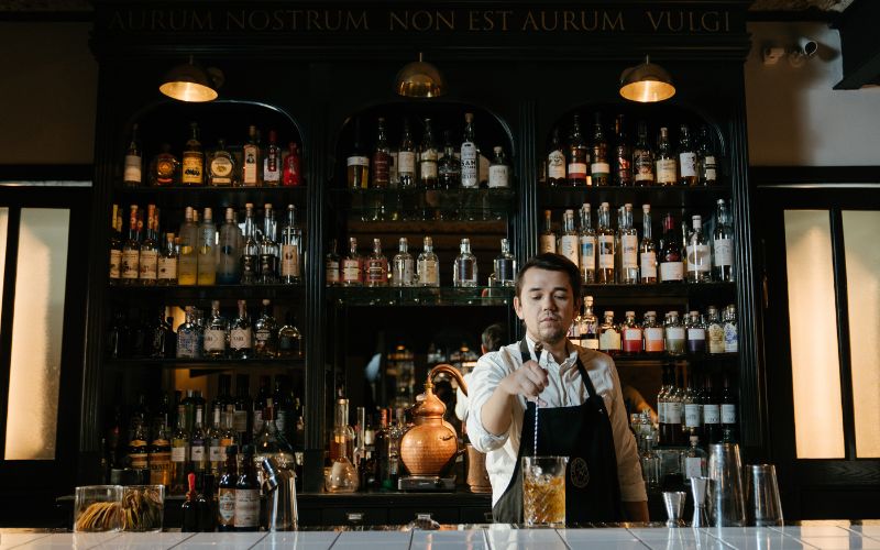 Bartender steering a drink in a bar