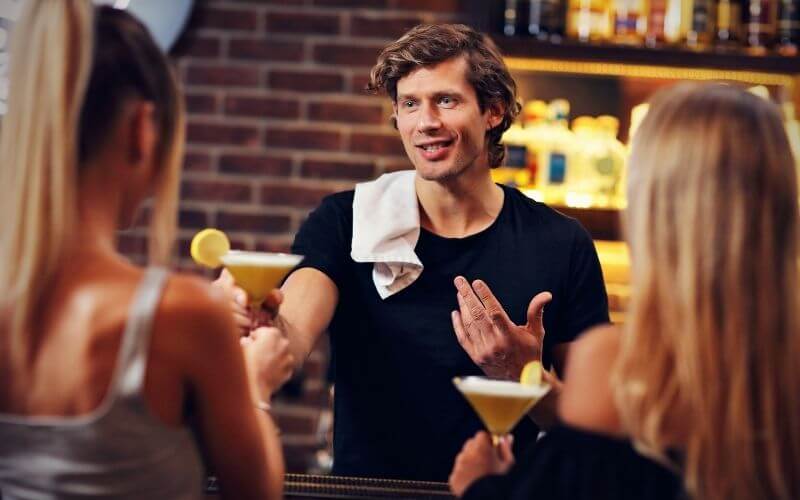 Bartender talking to two women