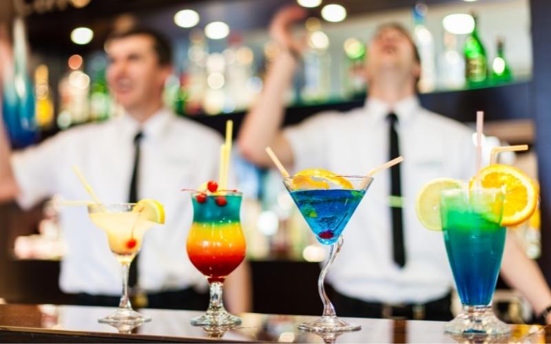 Bartenders with cocktails on the countertop