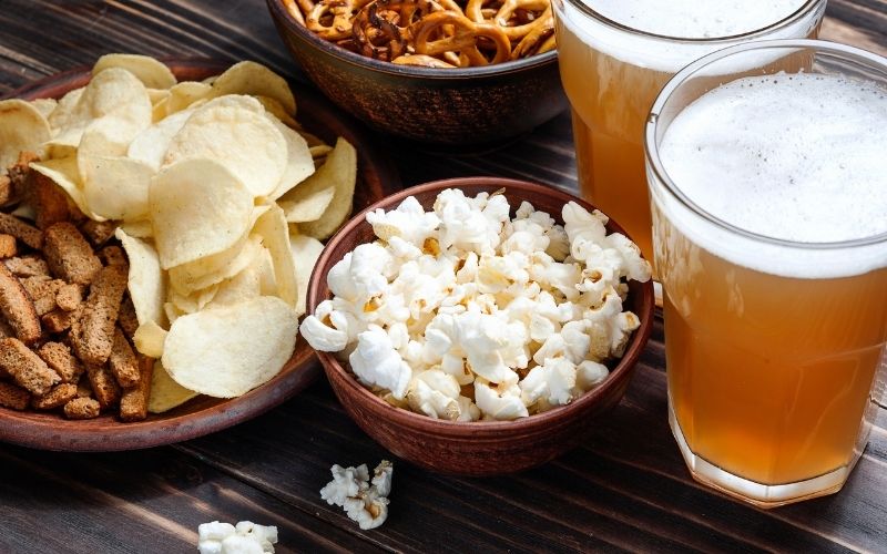 Beer snacks on wooden table