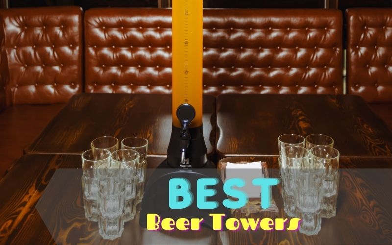Beer tower and glasses on a wooden table
