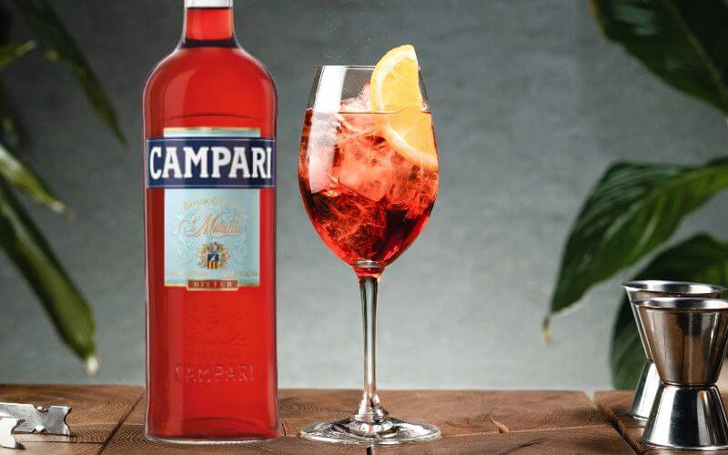 Bottle of Campari and a cocktail