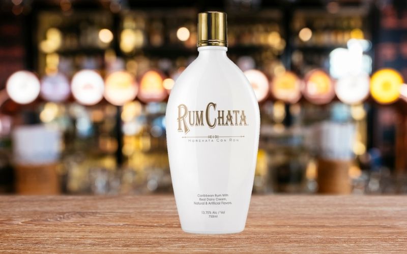Bottle of RumChata on a wooden table