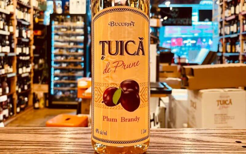 Bottle of Ţuică in a store - Image by Arthur Cantina