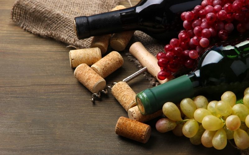 Bottles of Wine, Grapes, and Corks