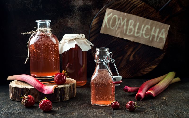 Bottles of kombucha with strawberries