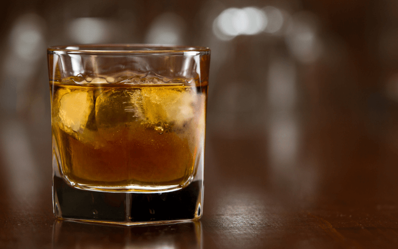 Glass of bourbon with ice