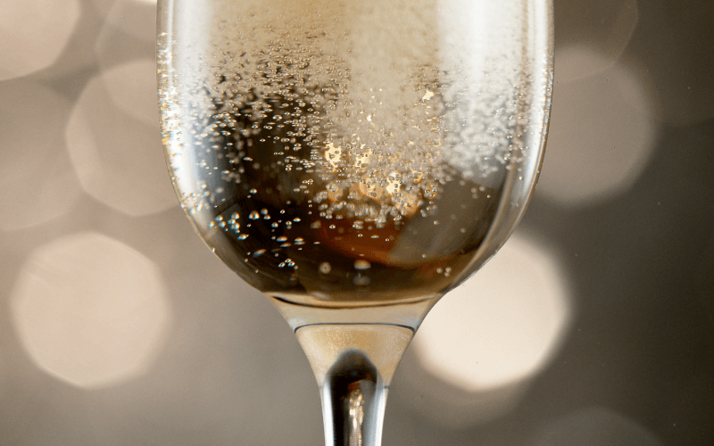 Closeup of a glass of Champagne with bubbles