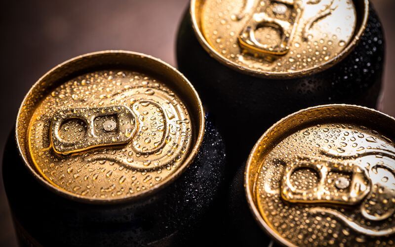 Closeup of cans with condensation on the outside