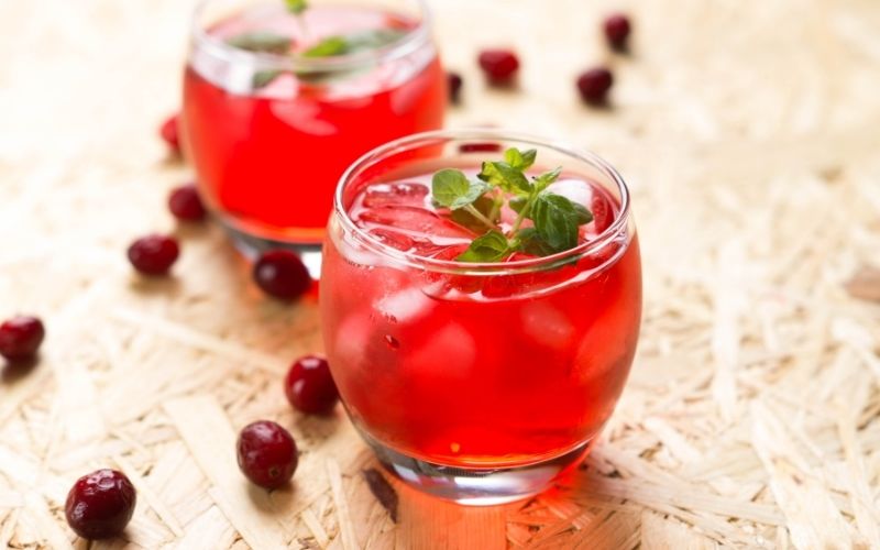 Cocktail in a wide glass with cranberry cordial