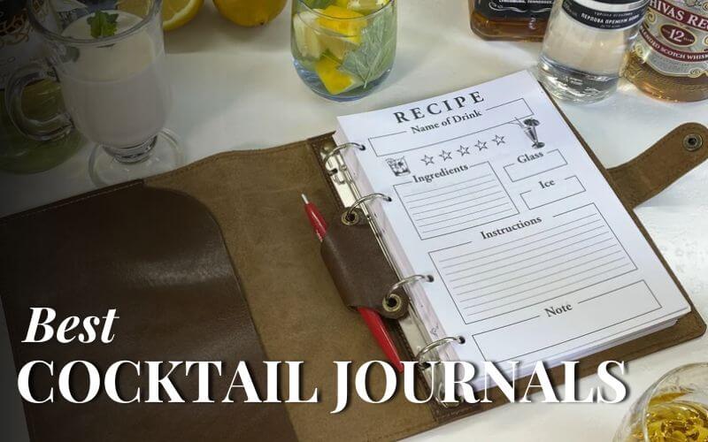 Cocktail journal and a pen on a table with drinks