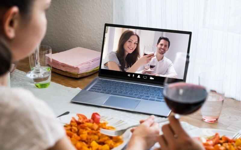 Couple having a virtual wine tasting and dinner