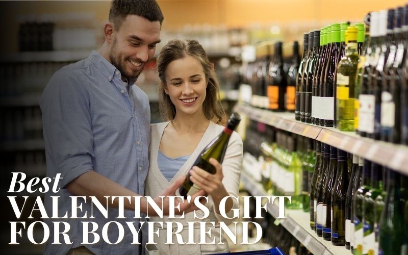 Couple holding a glass of wine or liquor in a store