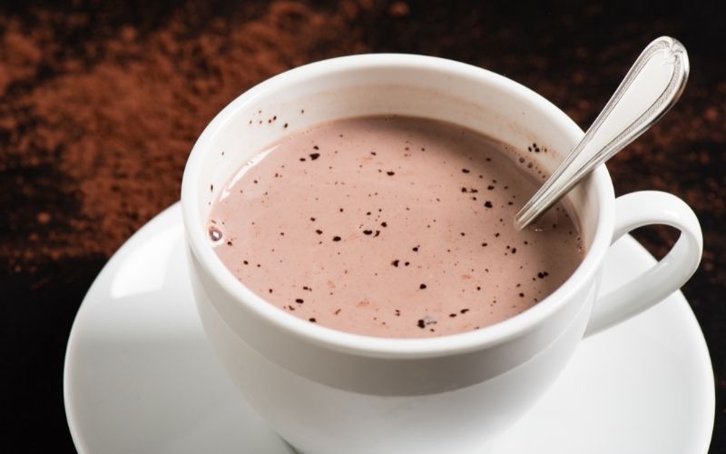 Cup of hot chocolate with a spoon
