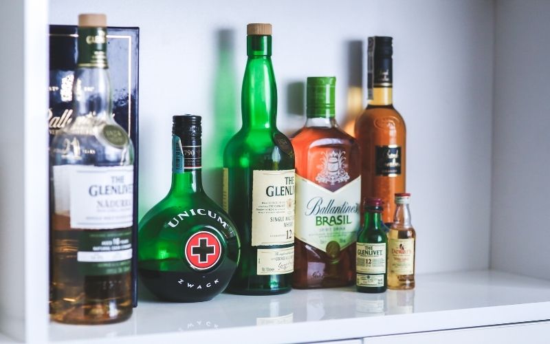 Different whiskey bottles on a shelf