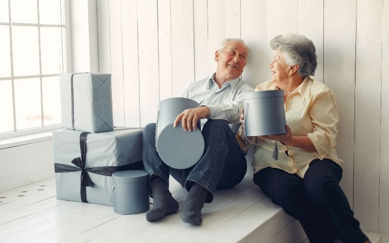 Elderly couple with gifts