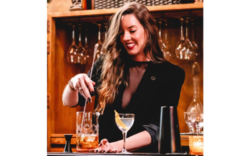 Elissa Dunn mixing a cocktail