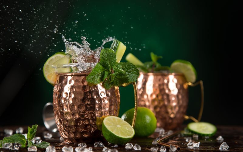 Famous Moscow mule alcoholic cocktail in copper mugs