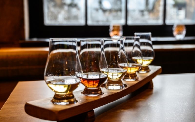 Flight of different whiskey types 