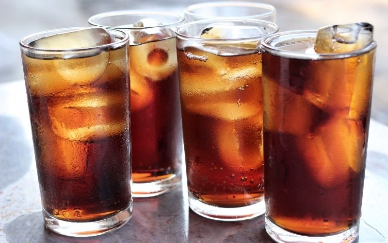 Four glasses of cola with ice