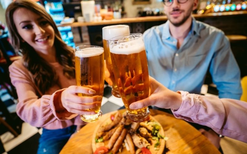 Friends using beer glasses