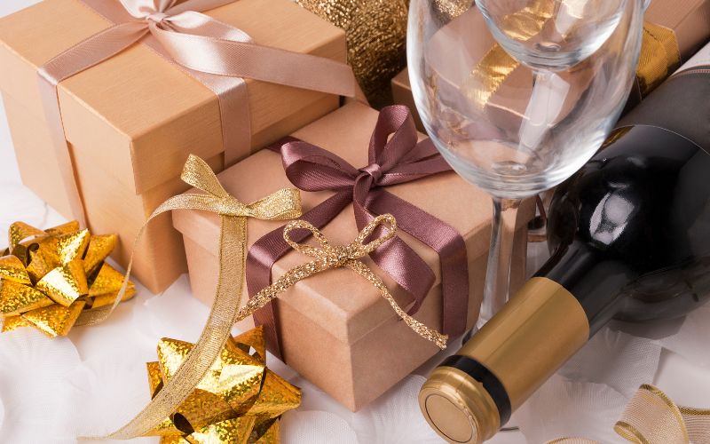 Gift Boxes with a wine glasses, wine bottle, and bows