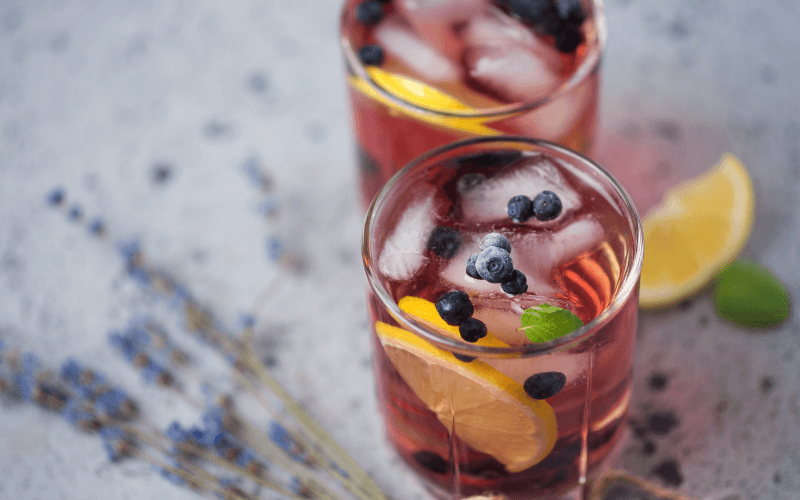 Glasses of Arandano spritz in a marble surface