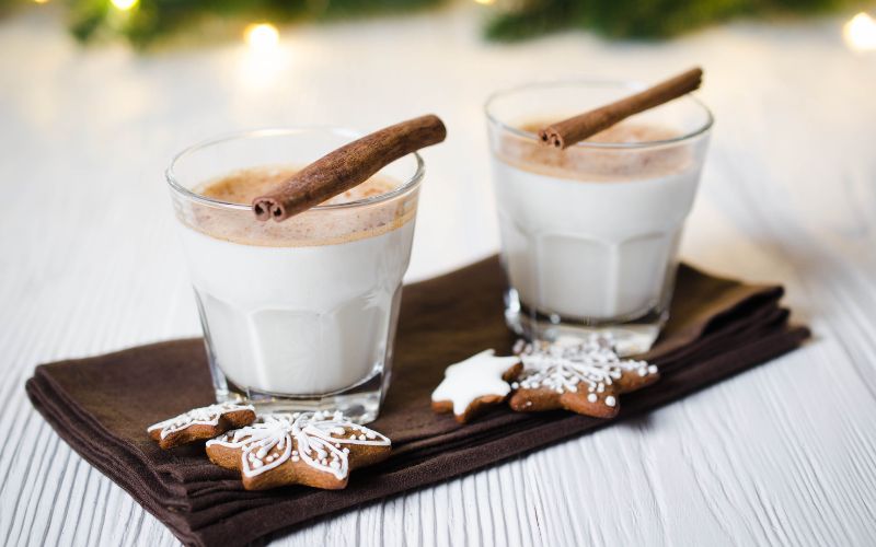 Glasses of Nooku bulldog with cinnamon and gingerbread on a white background