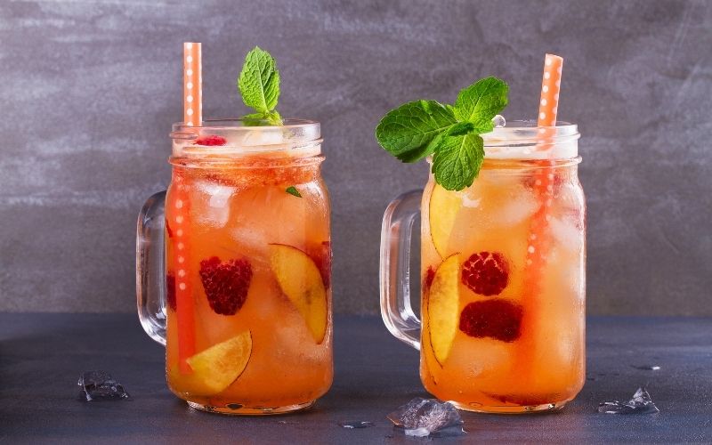 Glasses of Raspberry Peach Prosecco Punch