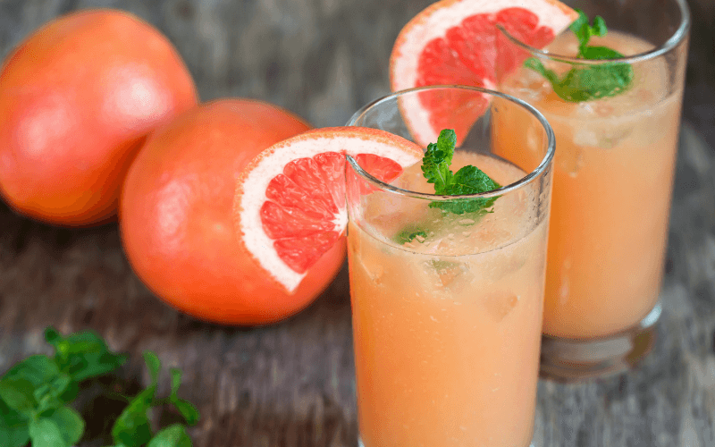 Glasses of casa Gingermint Paloma with grapefruits