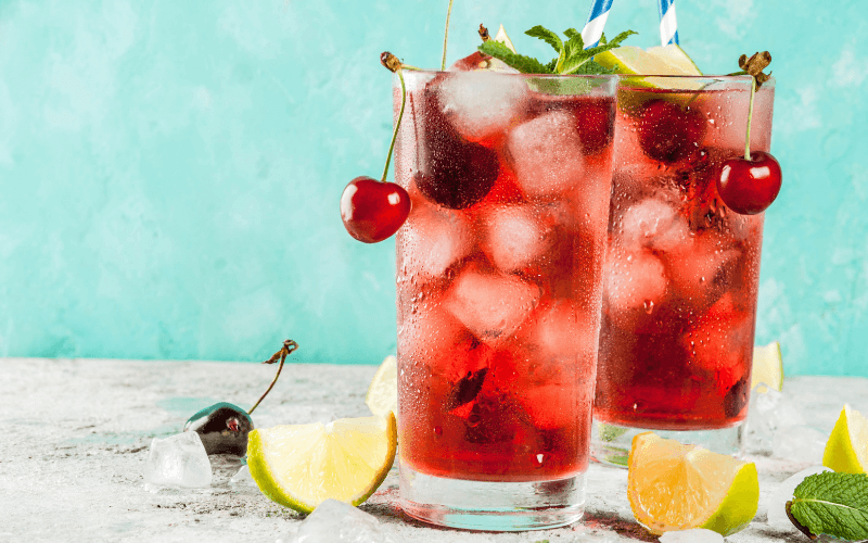 Glasses of cherry mojito mocktail in a light background