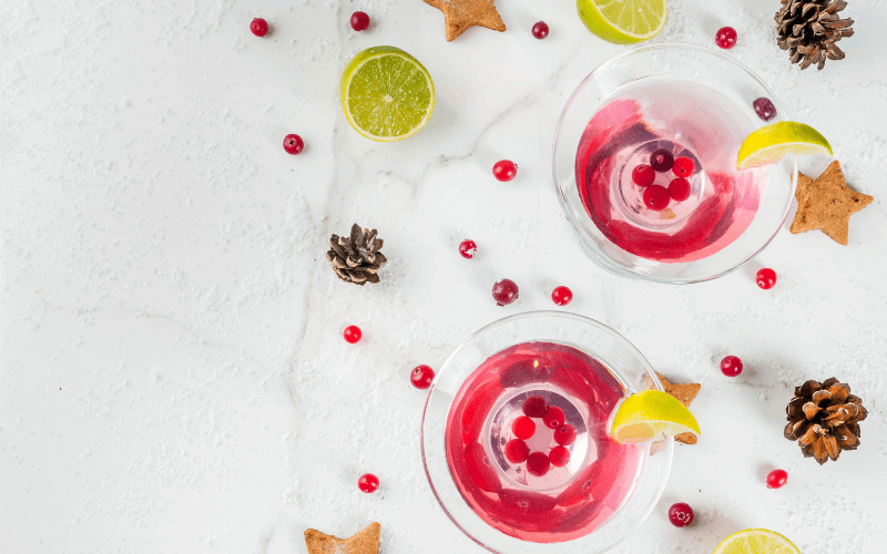 Glasses of mistletoe martini cranberry christmas cocktail