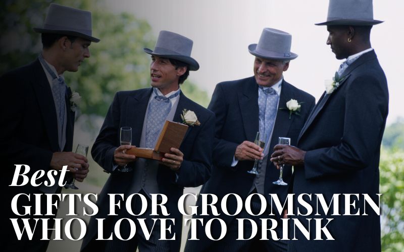 Groomsmen wearing top hats and holding drinks