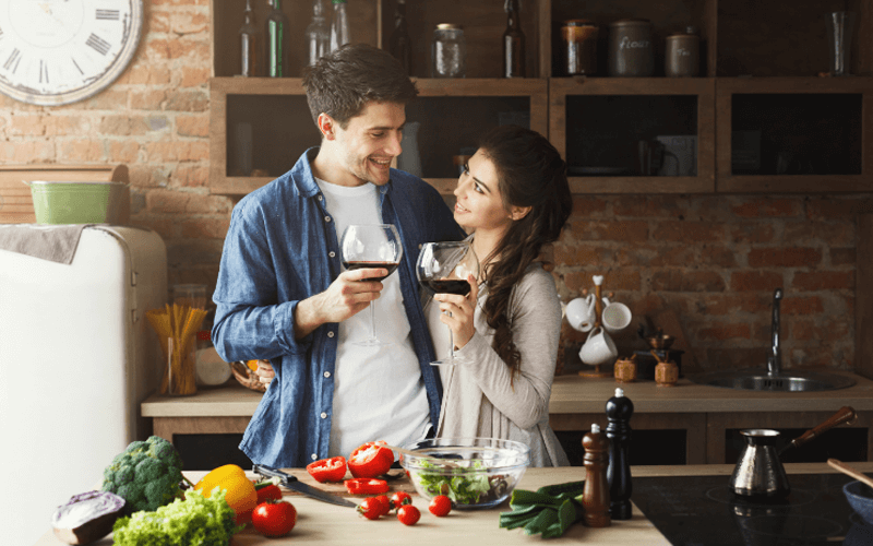 Happy couple cooking healthy food together