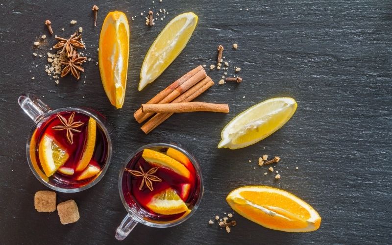Mulled wine ingredients on wooden background