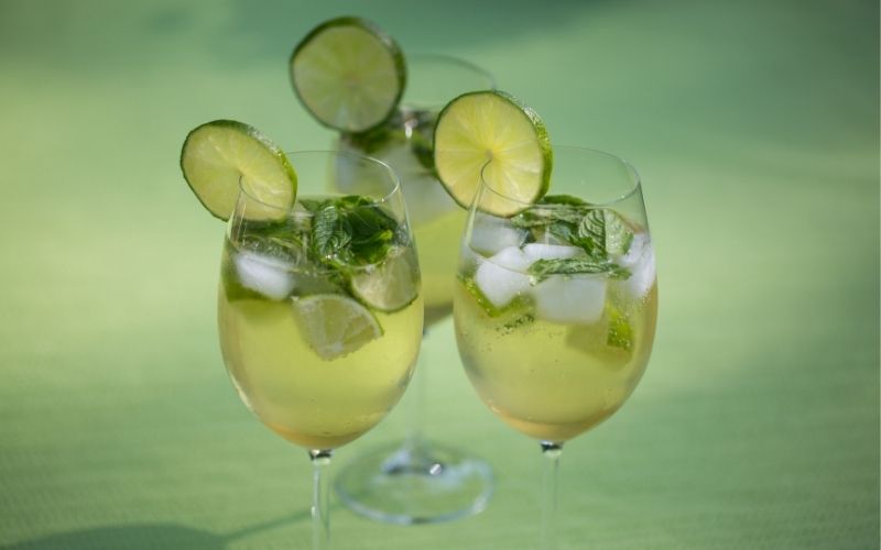 Hugo cocktails on green background