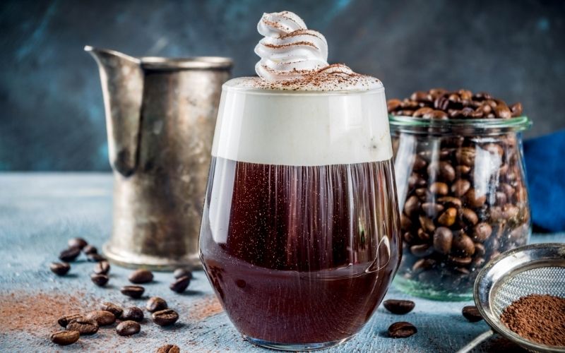 Irish coffee cocktail garnished with whipped cream