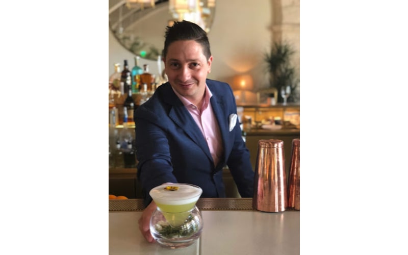 Jacopo Rosito serving a cocktail