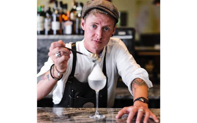 Josh Linfitt putting a garnish on a cocktail