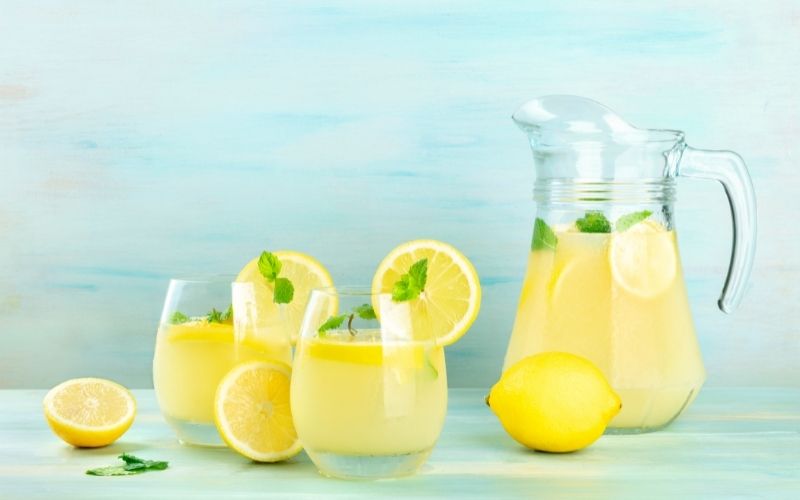Lemonade with mint and glasses and a pitcher
