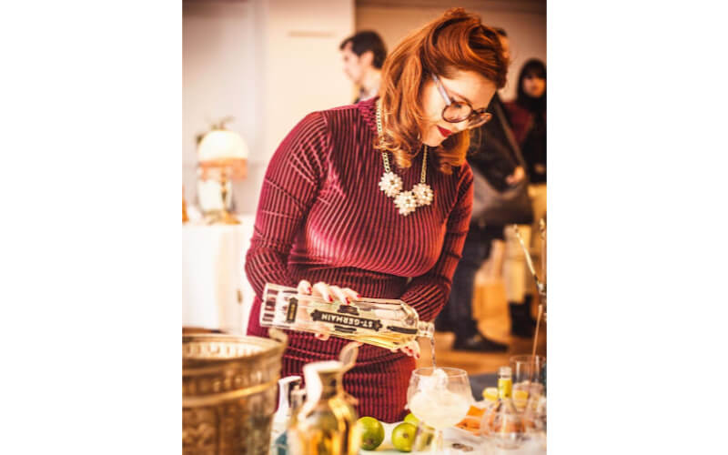 Lulu St Germain pouring liquor