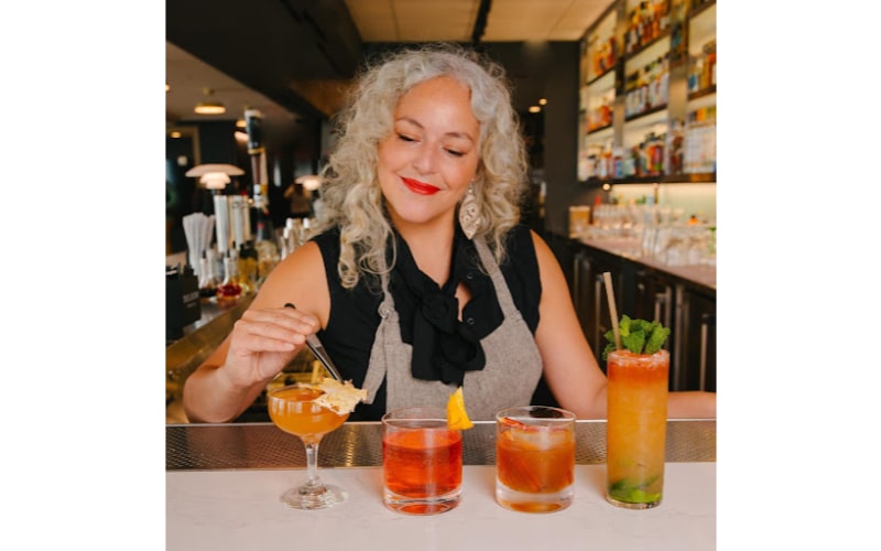 Lynnette Marrero mixing cocktails