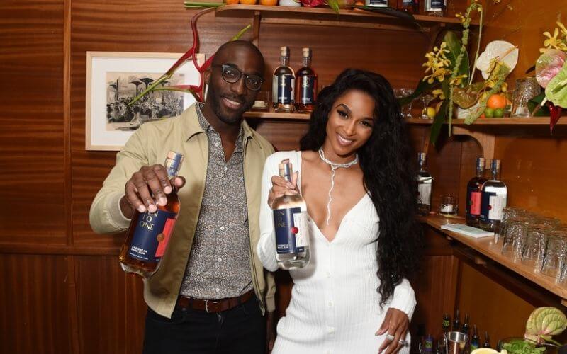 Marc Farrell and Ciara holding bottles of Ten To One rum - Image by the PRNet