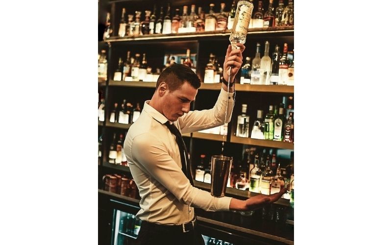 Marco Tordinac pouring liquor into a glass