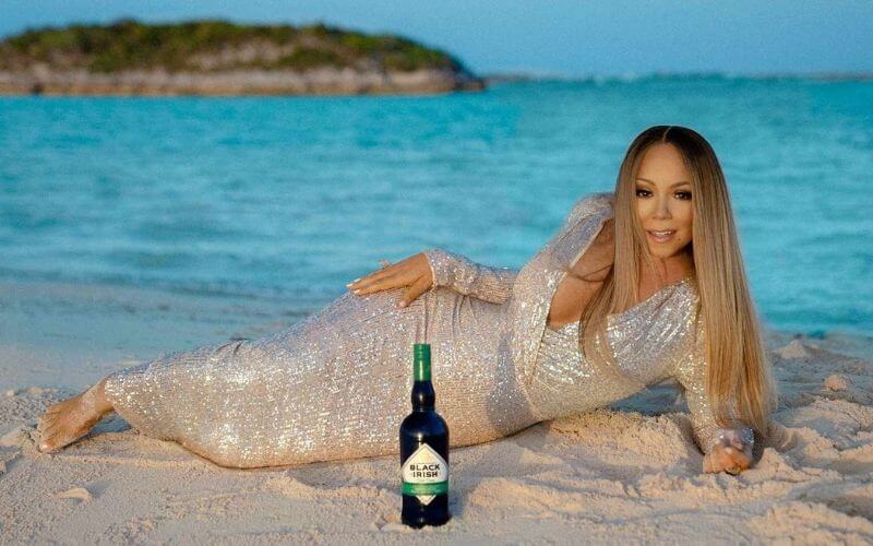 Mariah Carey with a Black Irish liqueur bottle - Image by Black Irish