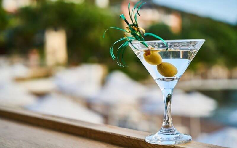 Martini Extra Dry Vermouth in a glass with olives